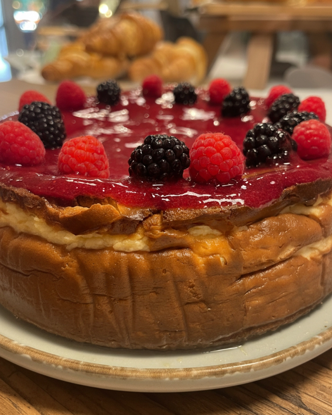 Berry swirl Basque cheesecake with home-made mixed berry coulis.